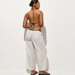 Beach pant with pom-poms