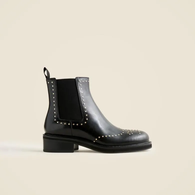 Chelsea wing tip boots in studded leather