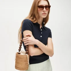 Handknotted rattan bucket bag with wood beads