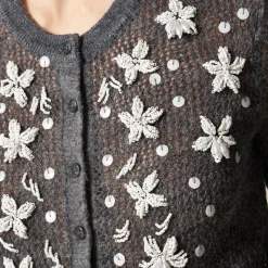 Loose-knit cardigan with floral embellishments